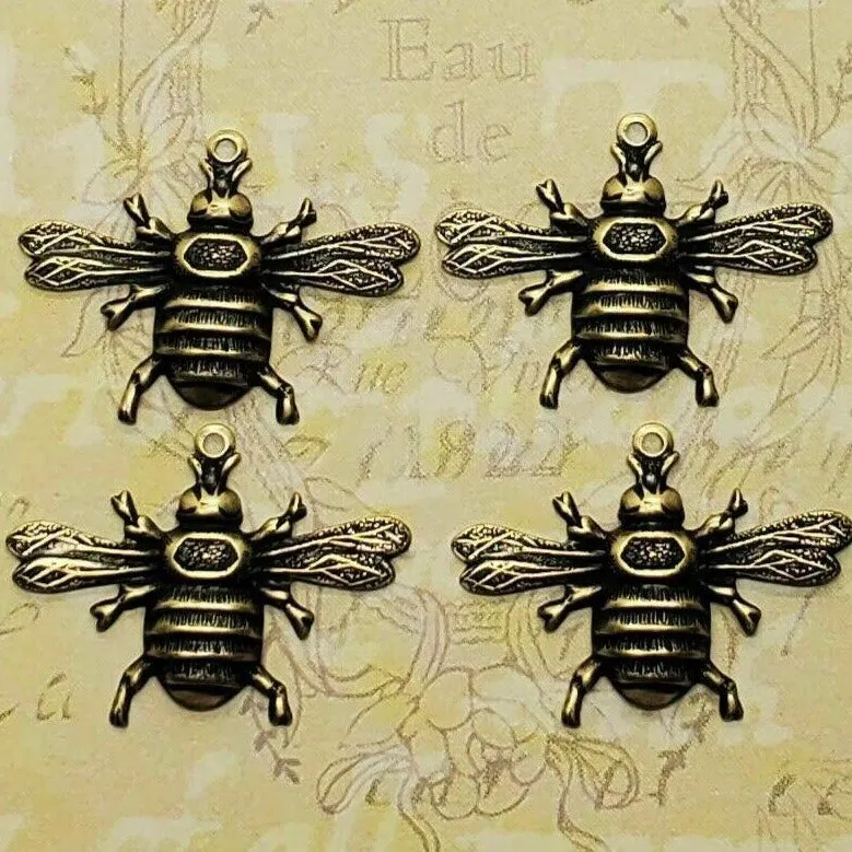 X Small Brass Bee Stampings With Ring x 4 - 6593WRRAT.